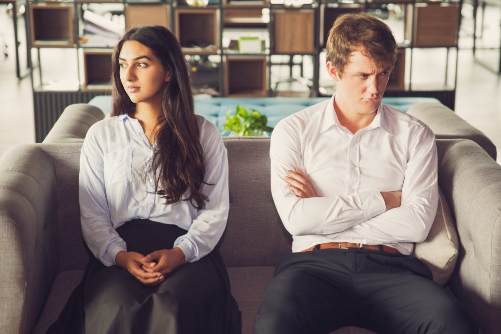 Couple experiencing relationship conflict and emotional distance during a difficult relationship transition